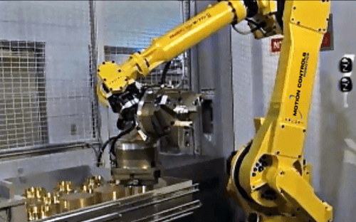 This M710 series robot is being used for CNC tending using a set of drawers for raw and finished parts. Click on the image to watch the video